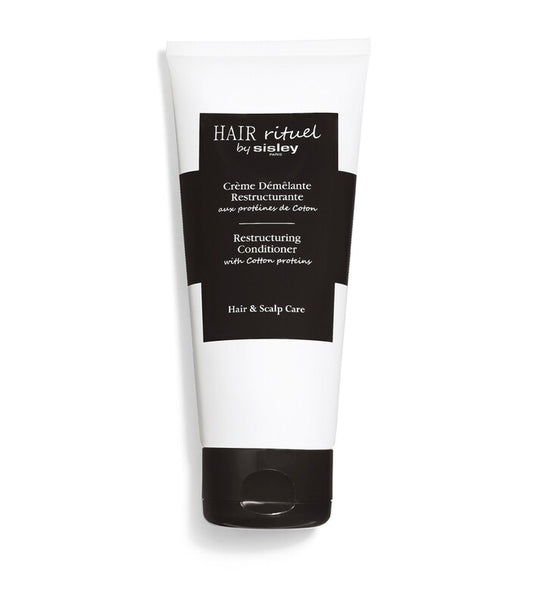 Sisley Hair Rituel Restructuring Conditioner 200ml tube on a white background